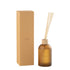 Geurstokjes Accords Essentiels Santal Satiné 550ml van J-Line, gele glazen fles met geurstokjes naast de geschenkdoos